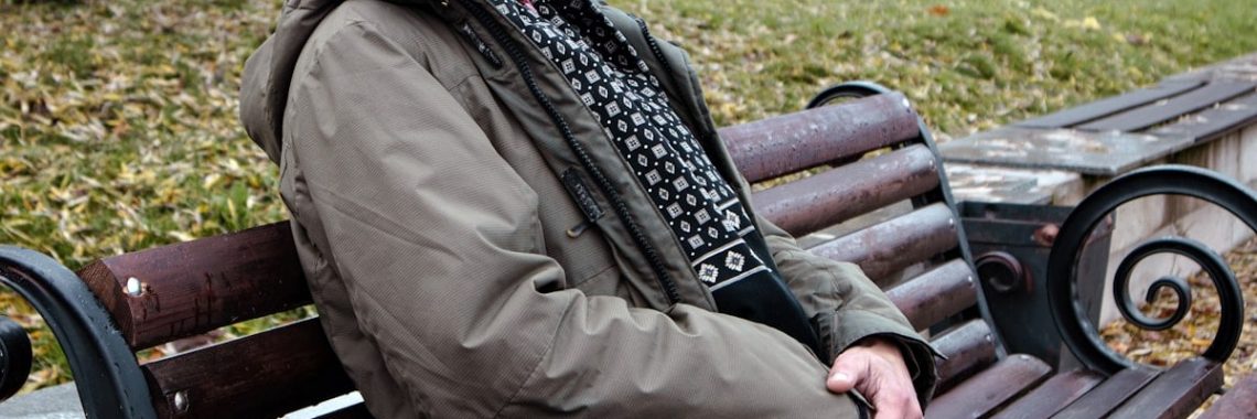 a person sitting on a bench